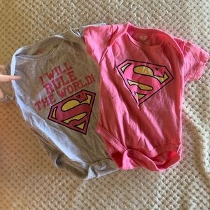Pair of baby girl super women onsies